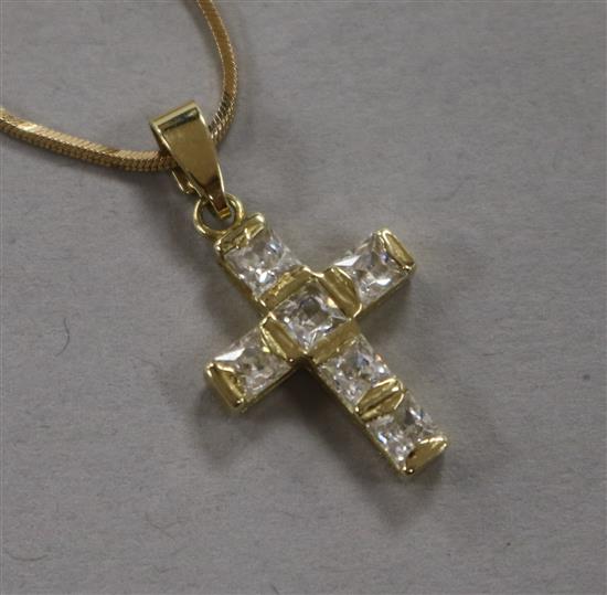 A 14ct gold and cubic zirconia set cross pendant, on a 14ct gold chain, pendant 18mm.